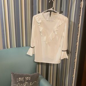 White blouse with black trim